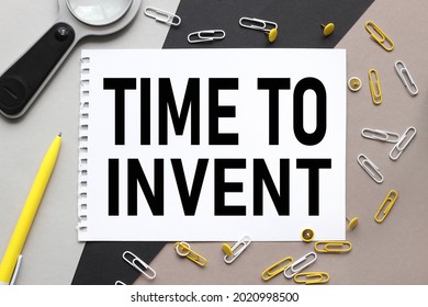 Time to Invent. notepad on a background of different colors. brown, black, gray