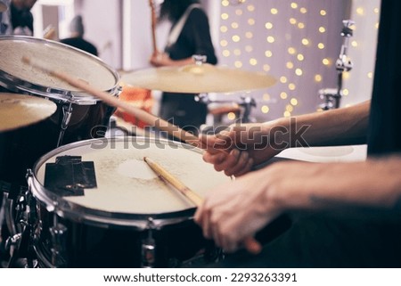 Time to jam out. an unrecognizable drummer playing drums during a band practice at home.
