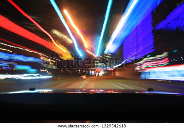 Time\
lapse image of a night drive in downtown\
Dallass