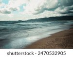 Time lapse, landscape photograph of waves breaking against the rocky shoreline of Agawa Bay campground along Lake Superior in Ontario, Canada