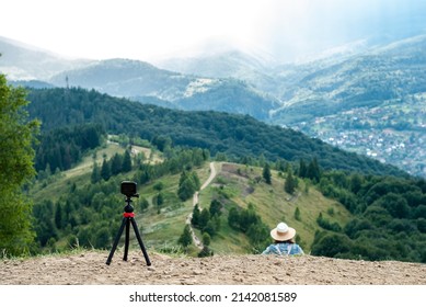 Time lapse shooting at the top of the mountain. Action camera on a tripod in the mountains. Shooting a beautiful mountain scenery while traveling. Ukrainian Carpathians