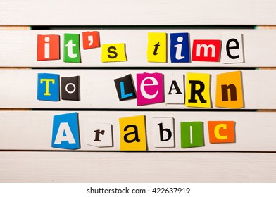 It's time to learn Arabic - written with color magazine letter clippings on wooden board. Learn arabic Concept - Shutterstock ID 422637919