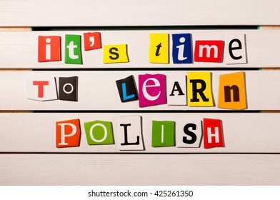 It's time to learn Polish - written with color magazine letter clippings on wooden board. Concept image - Shutterstock ID 425261350
