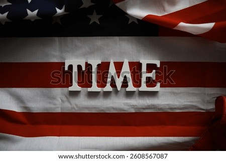 TIME Letters on American Flag Background Symbolizing Patriotism and National Values