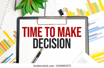 TIME to make decision text, pen are on the desktop. Business concept.