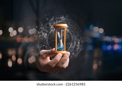 time management concept, businessman holding hourglass - Powered by Shutterstock