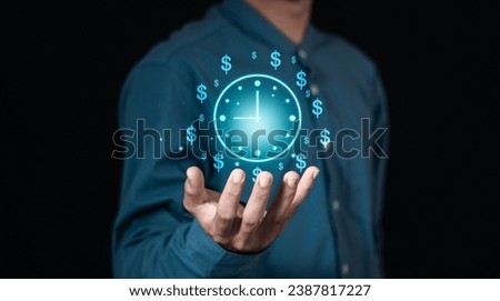 Time management concept, businessman holding clock and money icon on interface virtual for business time management. time is money, work planning increases efficiency and reduces work time.