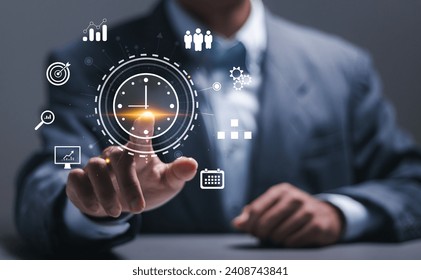 Time management concept. Businessman touching clock icon on virtual to work planning for increases efficiency and reduces work time. Business project planning. - Powered by Shutterstock