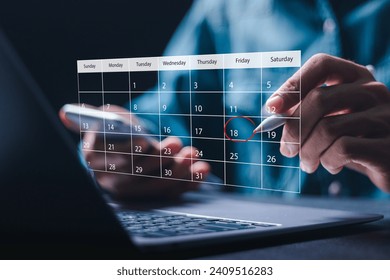 Time management concept. Businessman use laptop to manage time for effective work. Calendar on the virtual screen interface. Highlight appointment reminders and meeting agenda on the calendar.  - Powered by Shutterstock