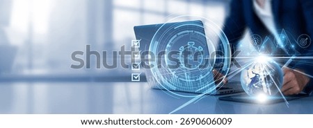 Time Management: Prioritization, scheduling, efficiency, planning, productivity. Businessman selects checkbox and uses laptop analyzing data graph growth on global network.