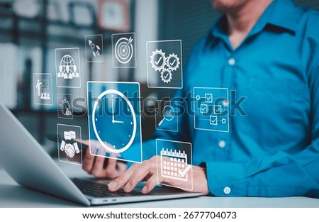 Time Management and Productivity Optimization Concept. Business professional using laptop with digital icons representing time tracking, productivity, project scheduling, and task coordination at work