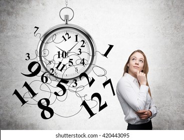Time management with thoughtful businesswoman and broken clock - Shutterstock ID 420443095