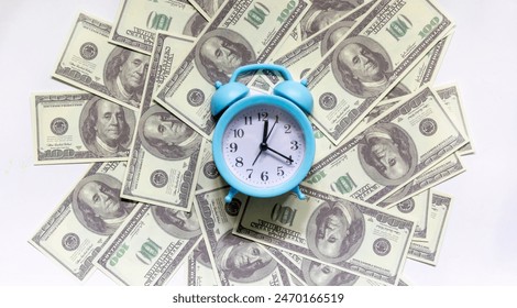 Time - money concept with clock and dollar bills closeup - Powered by Shutterstock