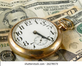 Time Is Money Concept Of Cracked And Dusty Antique Pocket Watch On US Currency