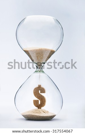 Time is money concept with falling sand taking the shape of a dollar