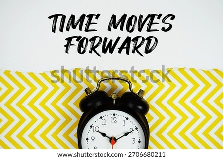 Time Moves Forward text written on paper with alarm clock on yellow chevron background