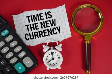 Time Is The New Currency text with alarm clock, magnifying glass anc calculator on red background