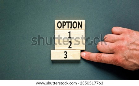 Time to option 3 symbol. Concept word Option 1 2 3 on wooden block. Businessman hand. Beautiful grey table grey background. Business planning and time to option 3 concept. Copy space.