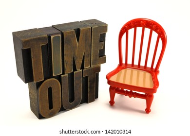 Time Out Chair Child Discipline Concept With Vintage Letter Press Letters And Red Chair.