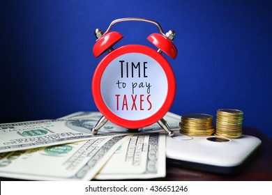 Time To Pay Taxes. Sign On Red Clock With Money And Coins. 