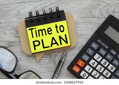 Time to Plan text on yellow paper. wooden background - Shutterstock ID 2308627943