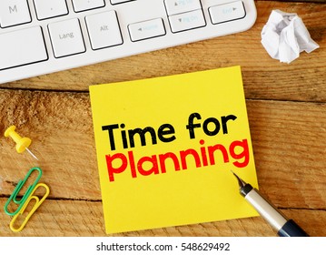 Time for planning/ Time for planning sticker with marketing plan inscription over computer keyboard