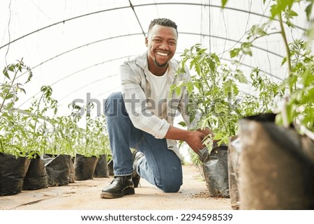 Time to plant some new crops. Full length shot of a handsome young man working on his farm.