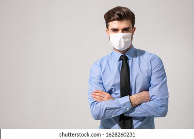 is time to protect all the time. elegant man wearing a mouth protection to prevent getting sick at work or on the way to work
