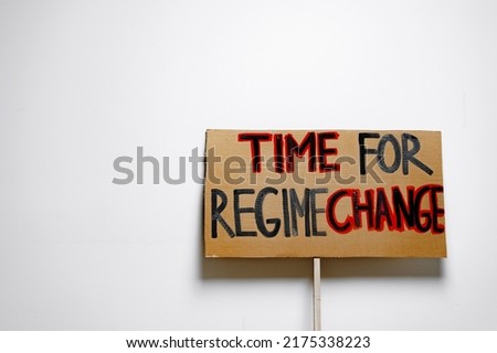 'Time for regime change' protest placard close up