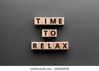Time to relax - word from wooden blocks with letters,  stop being angry or nervous, or to spend time relaxing, time to relax concept, gray background - Shutterstock ID 1604630548