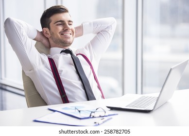 A Time For Relax. Young, Happy Businessman Is Relaxing In His Office.