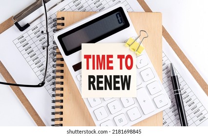 TIME TO RENEW Word On A Sticky With Clipboard And Notebook, Business Concept