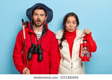 Time For Rest. Family Diverse Couple Spend Weekend Together In Nature, Going To Have Night Fishing, Carry Kerosene Lamp And Fishing Rod, Wear Warm Casual Clothes, Stand Over Blue Background.