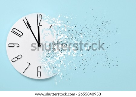 Time running out. Clock dissolving on light blue background