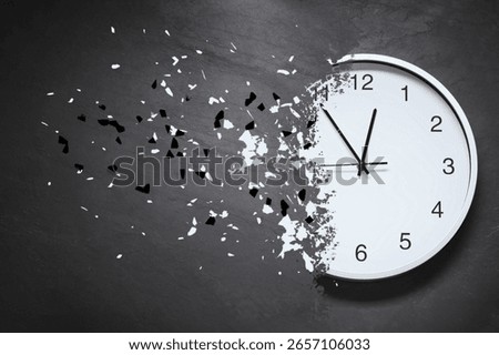 Time running out. Clock dissolving on grey textured background