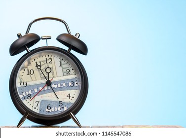 Time Running Out Concept For Social Security Trust Fund With Alarm Clock Approaching Midnight And Face Replaced By Card And Cash