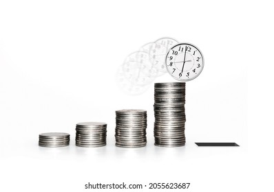 Time Is Running Out While Life Accumulating Wealth Is Lost. Money Is Useless When We Are In The Grave. Death Is The Only Thing That Can Stop Human Desires. Coins Stacks And Clock Face On White.