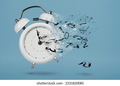 Time is running out. White alarm clock with flying numbers as a symbol of lost time. The concept of time is running out, loss or lack of time, an alarm clock with numbers shatters into small pieces. - Shutterstock ID 2231820085