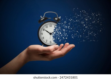 Time running out. Woman with dissolving alarm clock on blue background, closeup