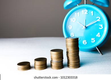 Time of saveing value money : Coin and clock, Idea of value to finance and saving money.