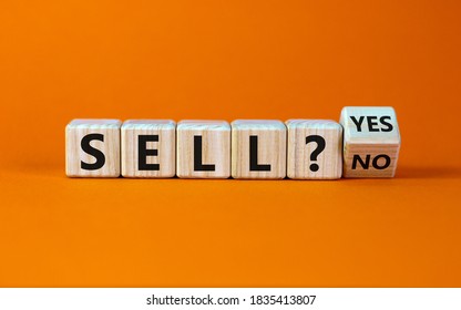 Time to sell. Turned a cube and changed the words 'sell no' to 'sell yes'. Beautiful orange background. Business concept. Copy space.