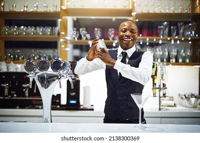 Its time to shake things up in here. Cropped shot of a well-dressed bartender standing behind the counter. - Powered by Shutterstock