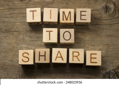 Time to Share text on a wooden background