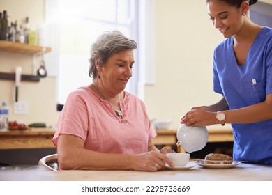 Time for some afternoon tea. a caregiver pouring a cup of tea for a senior patient in a nursing home. - Powered by Shutterstock