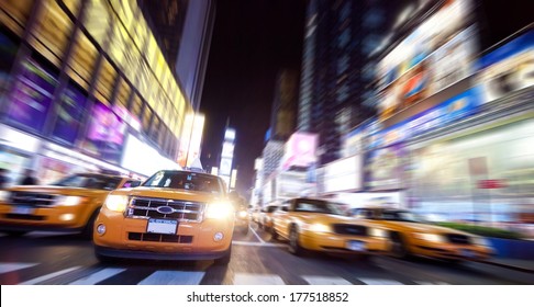 Time Square Full Of Taxi Cabs In The Night