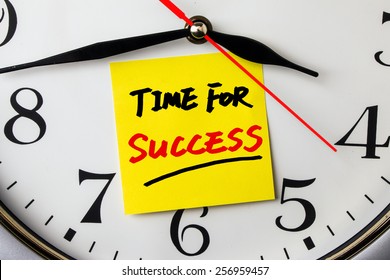 Time For Success On Post-it Stuck To A Wall Clock