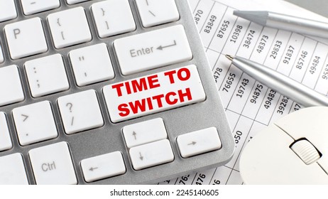 TIME TO SWITCH text on keyboard wirh chart and pencil