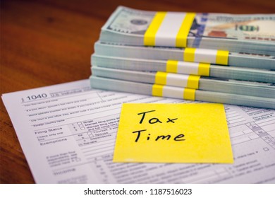 Time For Taxes. 1040 Tax Form With Money On Table. Lodging Your Tax Return.