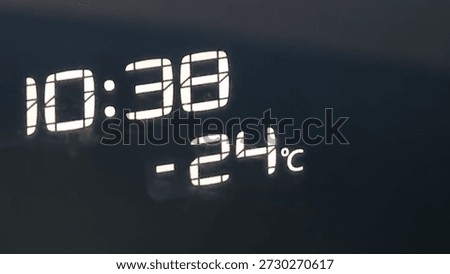 Time and temperature display shows cold conditions on a winter morning