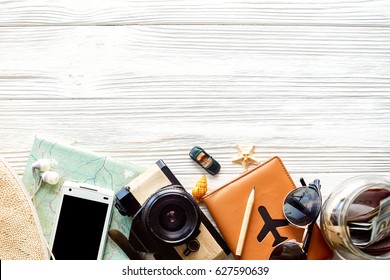 Time To Travel Concept, Wanderlust Vacation Background Flat Lay, Space For Text. Camera Sunglasses Passport Money Map Phone Hat Car Plane  On White Wooden Table. Planning Summer Holiday